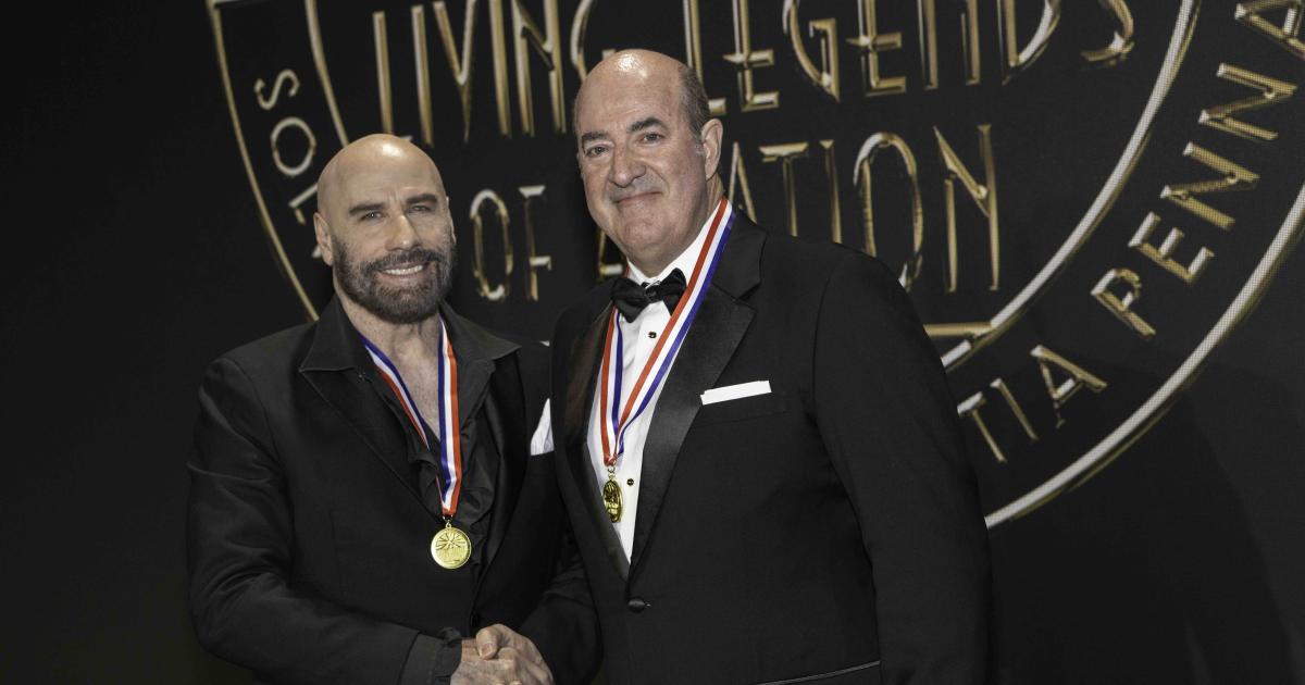 John Travolta and Mark Burns