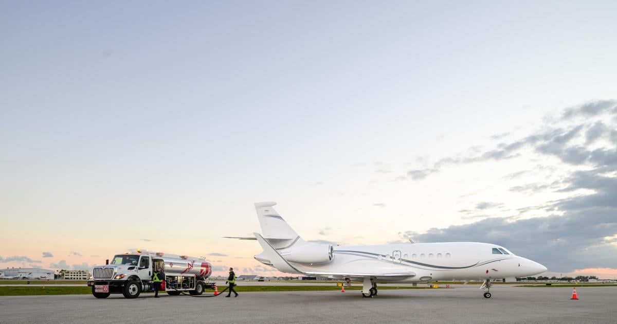 Avfuel tanker on ramp with business jet
