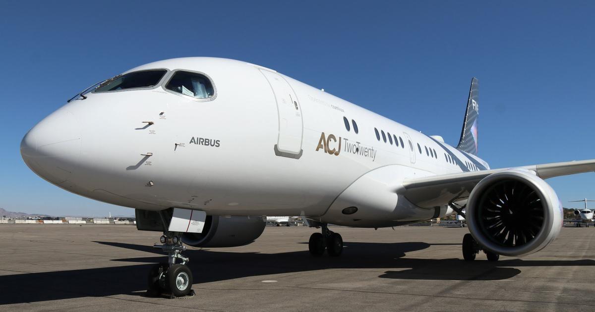 White ACJ TwoTwenty parked on ramp 