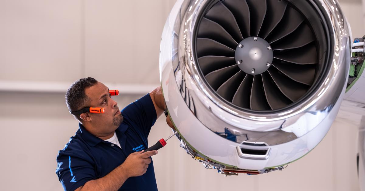 Technician examining engine