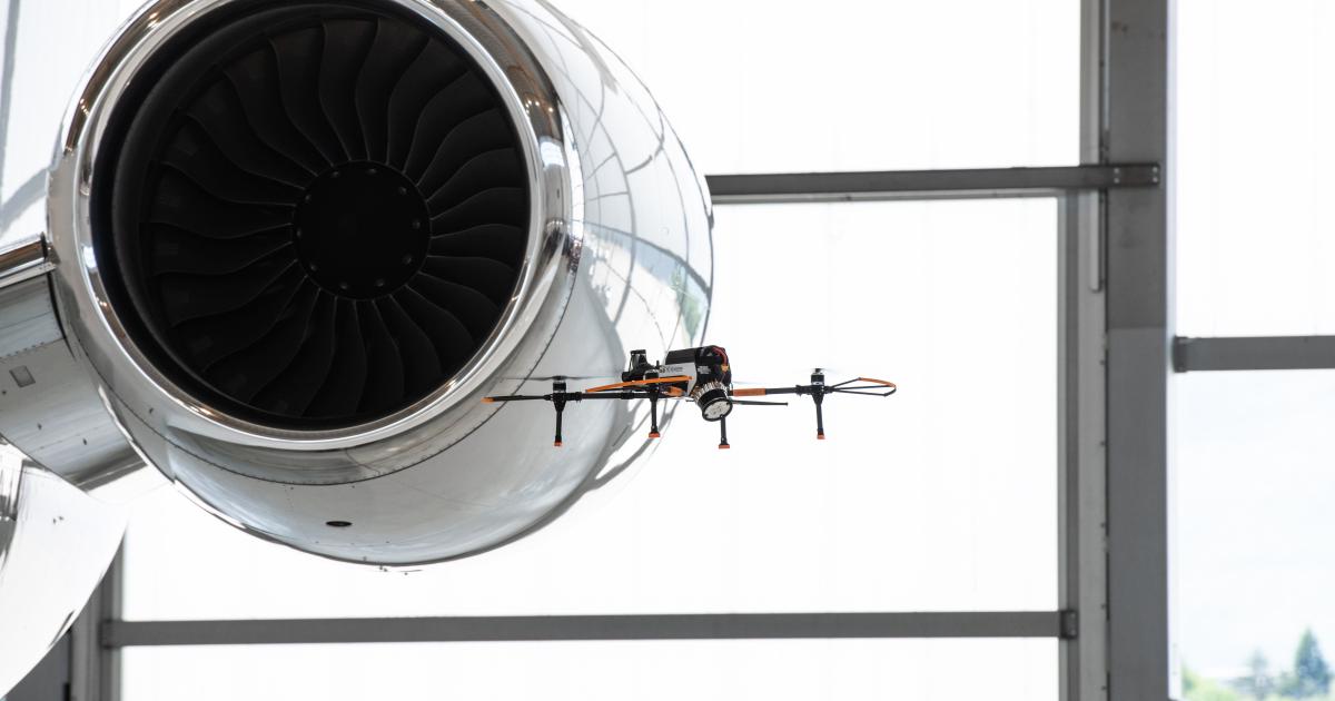 Drone conducting aircraft exterior inspection