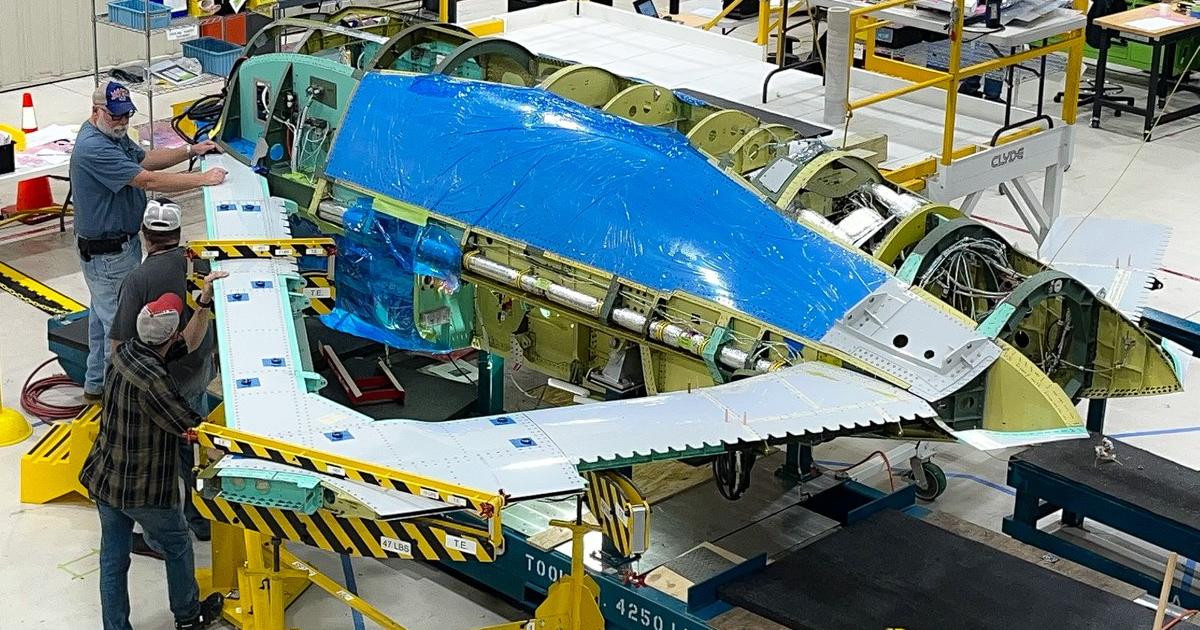 Novel triangular wing being fitted to X-65 fuselage 