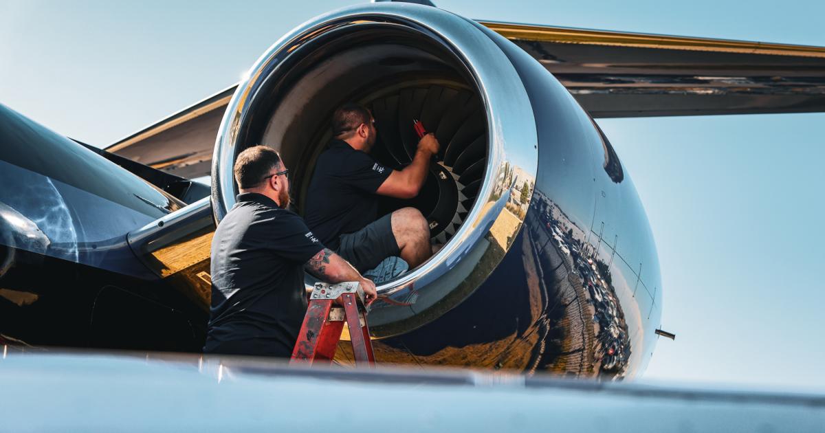 Duncan Aviation AOG technicians examining aircraft engine