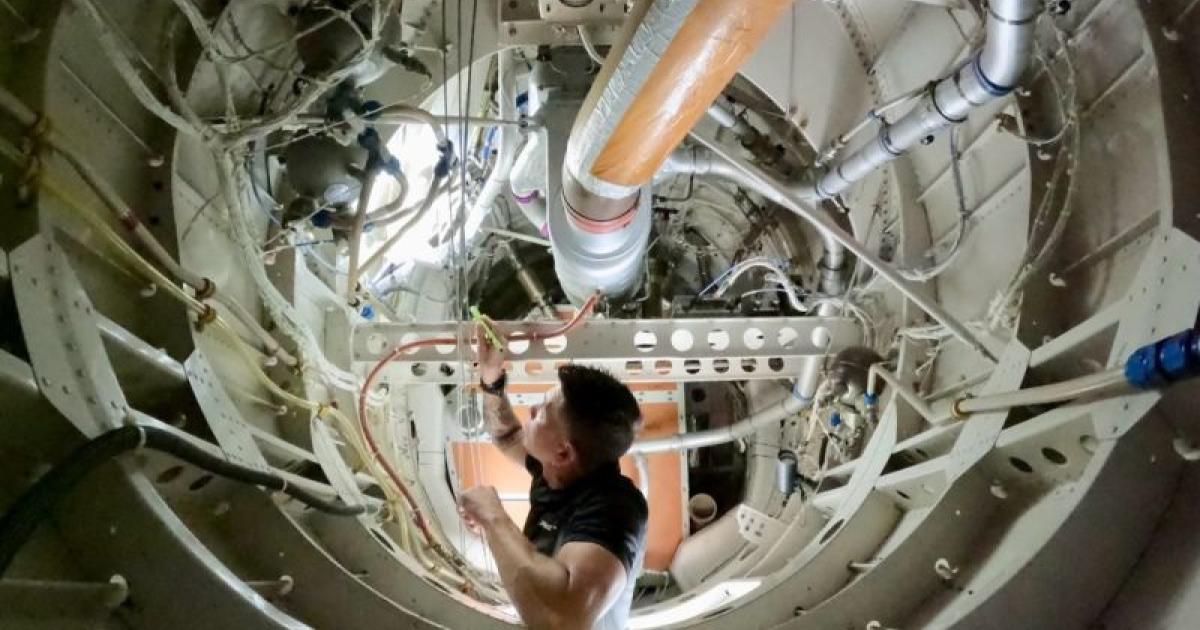 West Star Aviation technician inside aircraft 