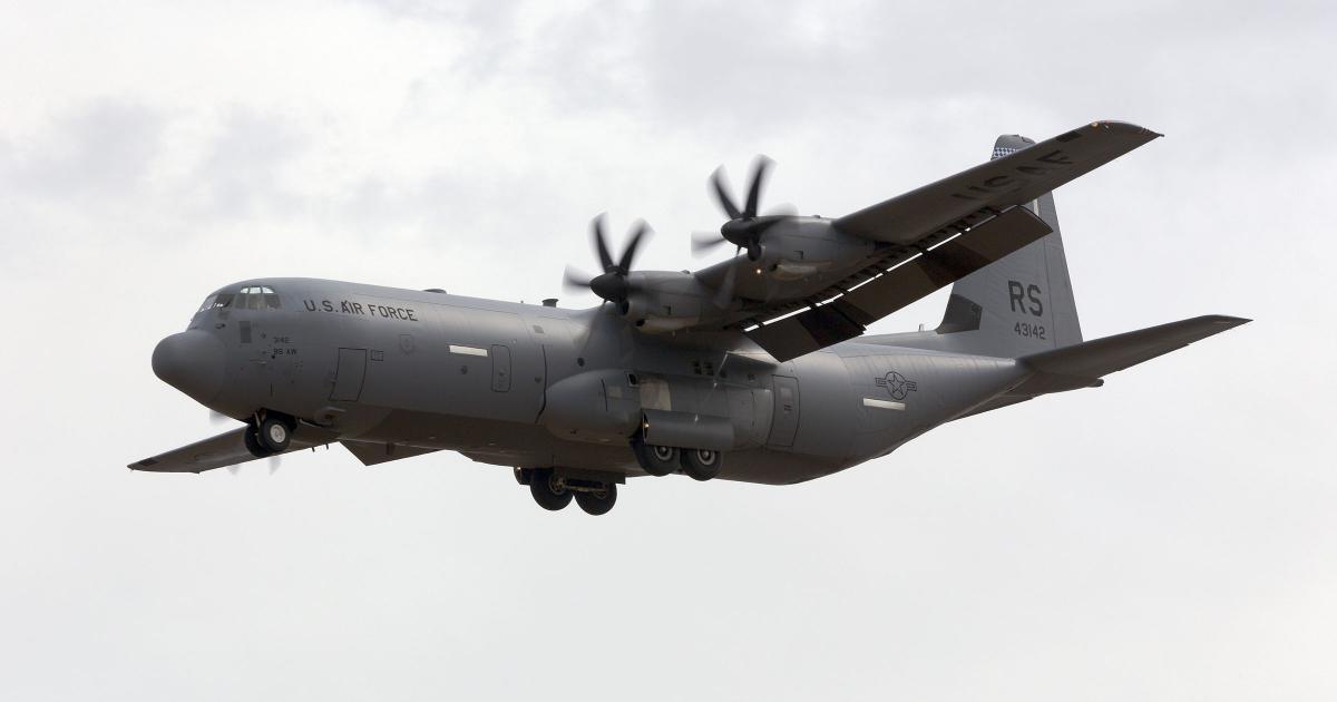 A gray U.S. Air Force C-130J Super Hercules turboprop transport aircraft in flight