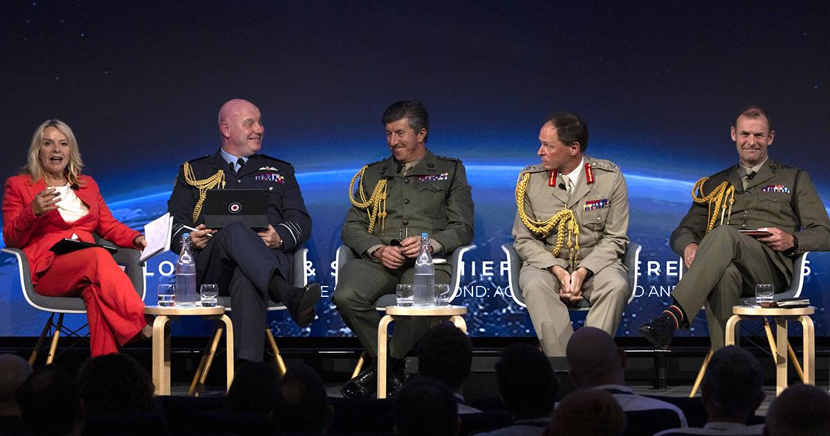 Five panel members seated