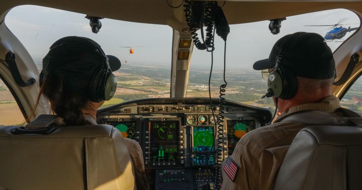 pilot and student in helicopter