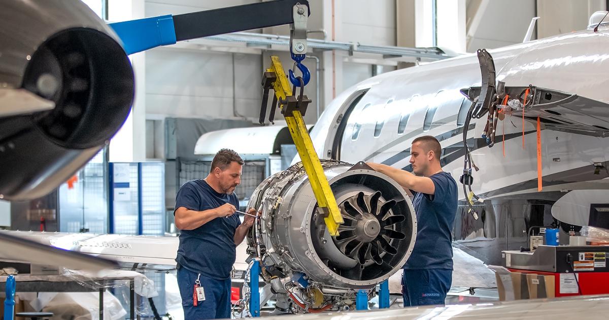 technicians perfoming engine swap