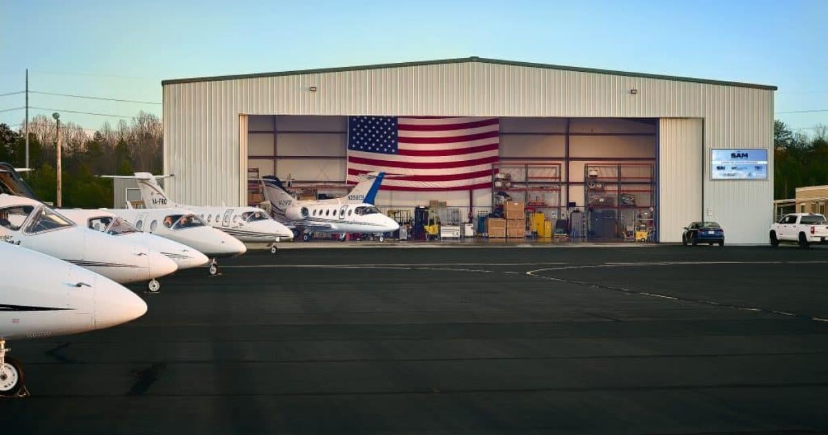 Sky Aircraft Maintenance hangar from the ramp with aircraft parked in front