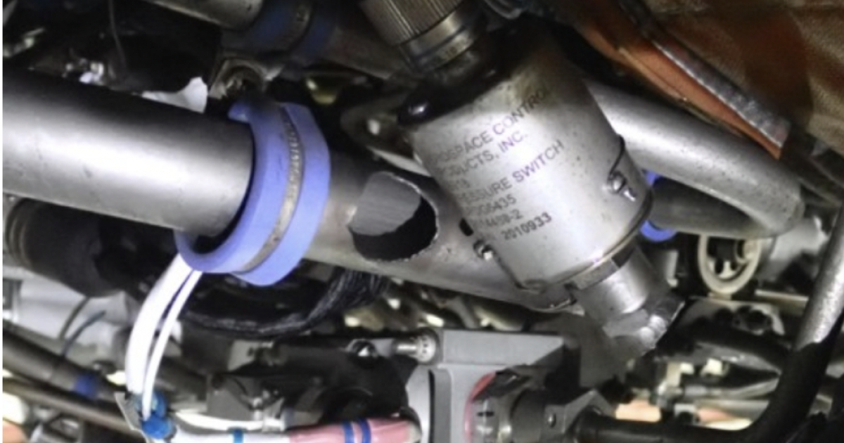 Figure 1 from the NTSB preliminary report: Right engine fuel tube assembly and fuel pressure switch, showing damage to the system