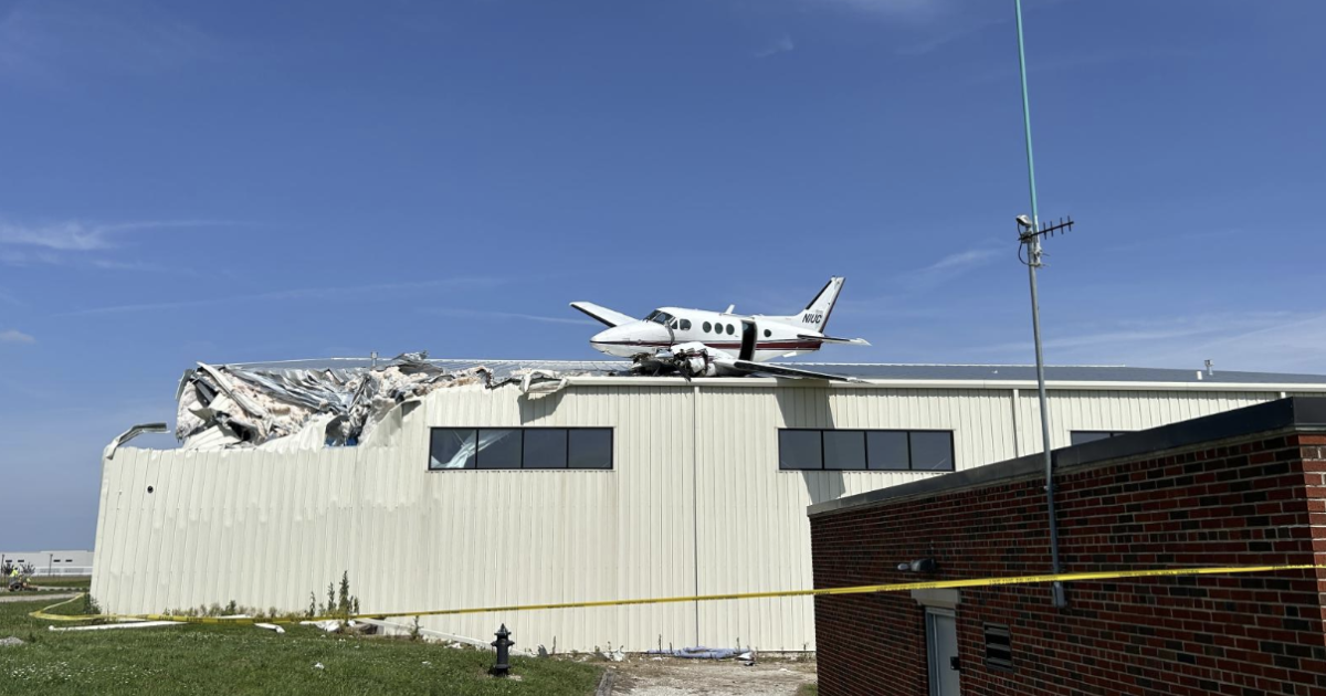 A King Air came to rest after crashing on top of a hangar at New Century airfield in Gardner Kansas