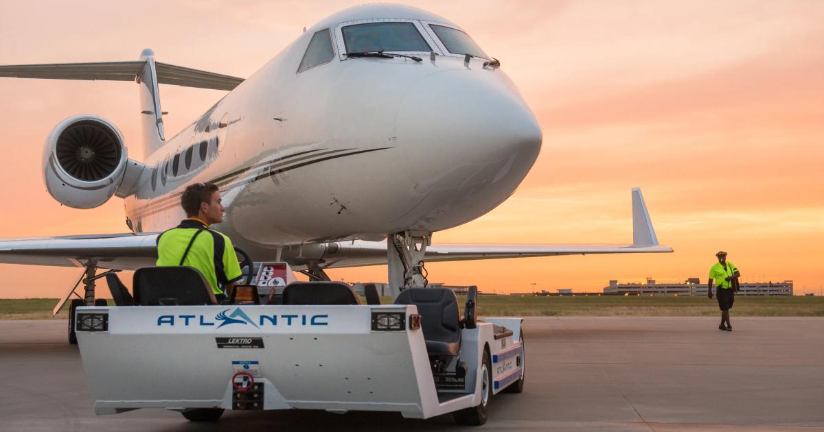 Atlantic line service tech towing business jet