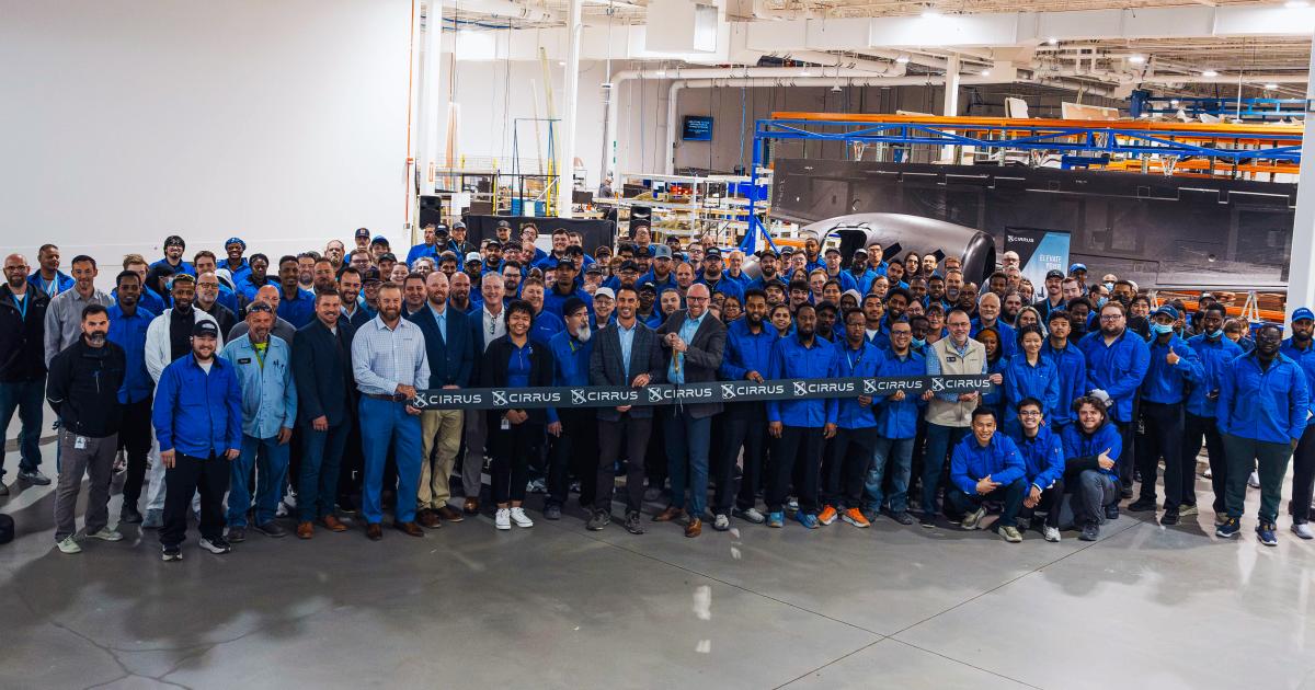 Cirrus employees celebrate the Grand Forks facility's expansion