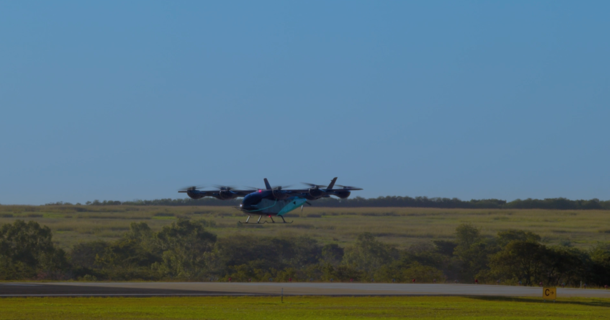 Eve prototype hovering above runway 
