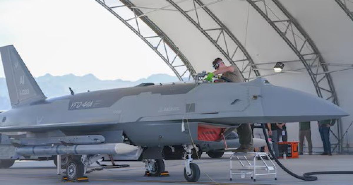 YFQ-44A drone in hangar, airman refuelling 