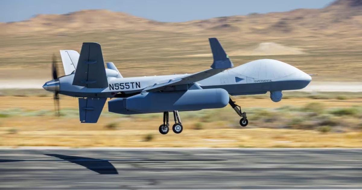 MQ-9 taking off from runway in desert 