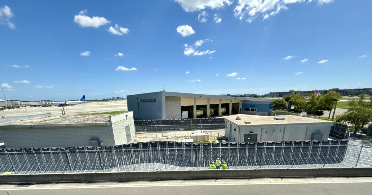 Hurricane protection fencing rises around the electrical system vaults at KTPA