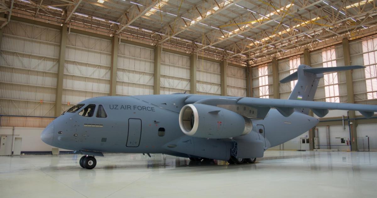 Grey C-390 in hangar 
