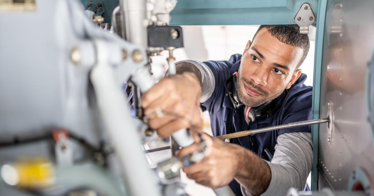 technician examining airframe