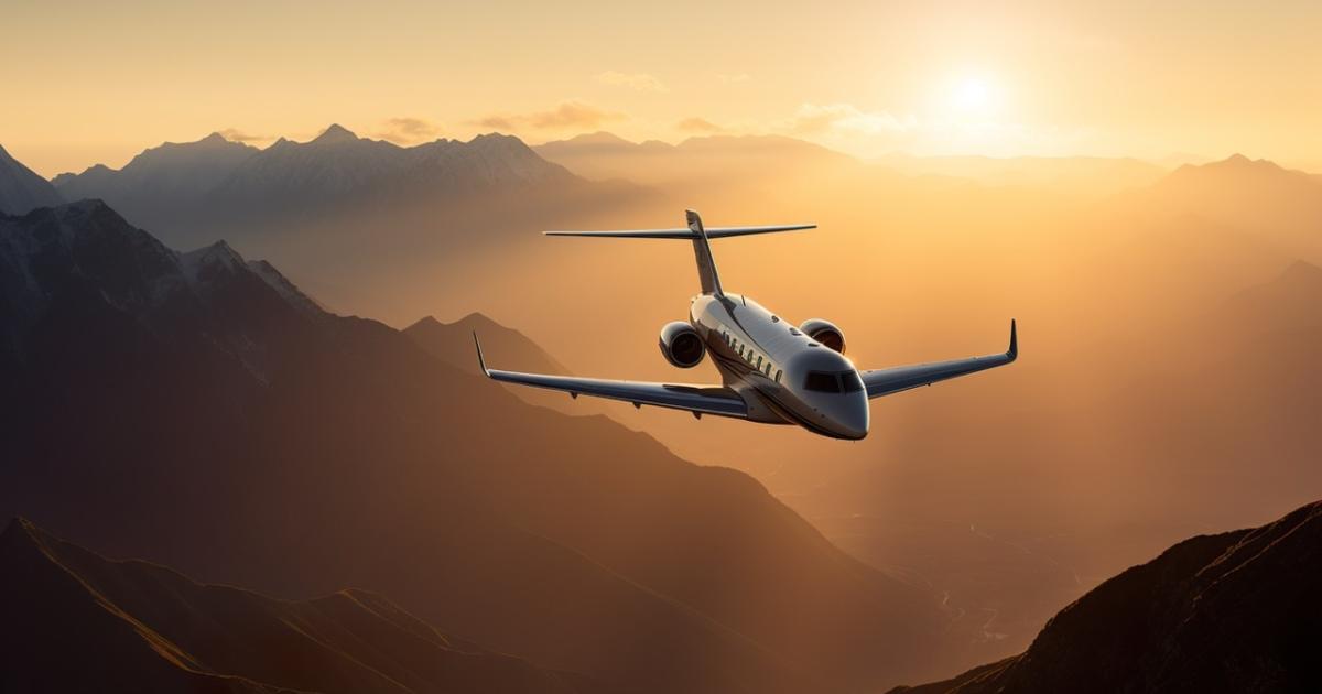 Biz-jet with sunlit mountains behind