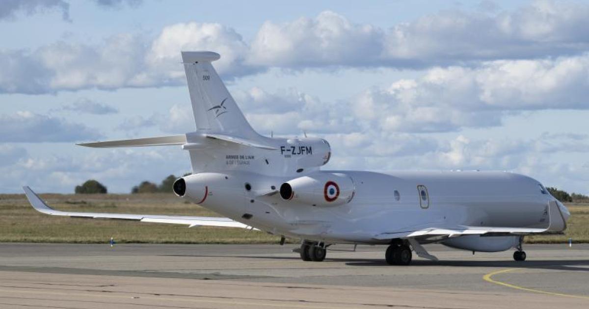 Modified grey Falcon 8X on tarmac 