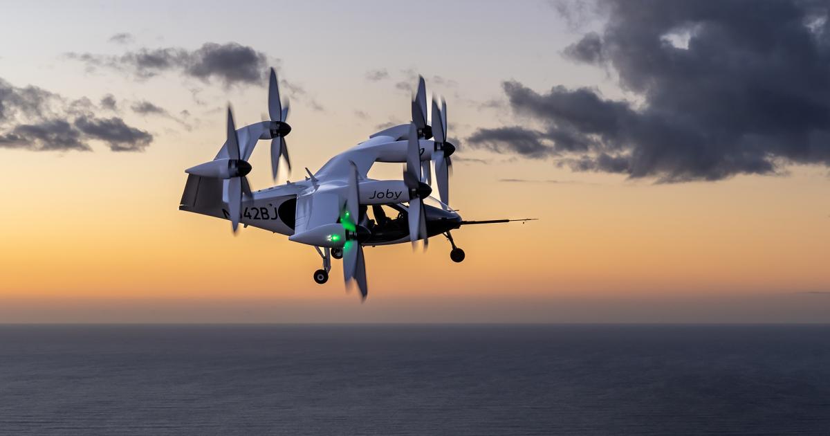 Joby's eVTOL air taxi is pictured in flight above the Pacific Ocean