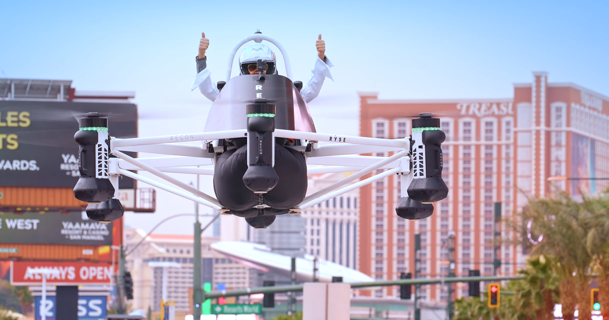 Erik Stephansen, Ryse’s director of regulatory affairs and aerodynamics, gives two thumbs up as he flies the Recon over Las Vegas during the 2023 Consumer Electronics Show.