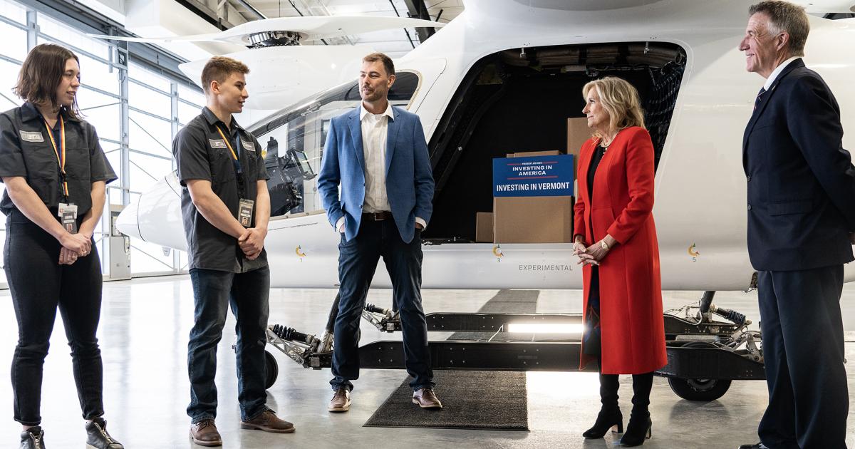 (From left) Beta Technologies interns Phoebe Peckham and Colton Poulin, and company founder/CEO Kyle Clark speak with first lady Jill Biden and Vermont Gov. Phil Scott at Beta's headquarters in South Burlington, Vermont, on April 5, 2023.