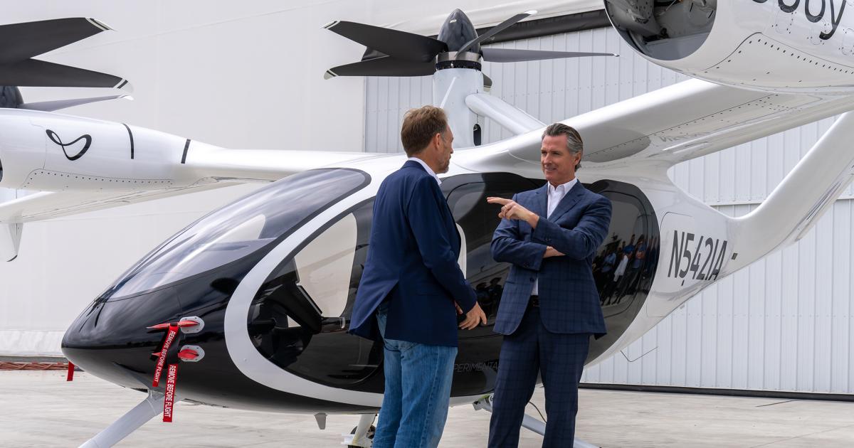 California Governor Gavin Newsom and Joby founder/CEO JoeBen Bevirt are pictured with Joby's eVTOL.