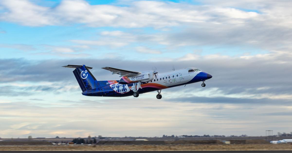 Universal Hydrogen's "Lightning McClean," a Dash 8 twin turboprop retrofitted with a hydrogen fuel cell propulsion system in one of its nacelles, is pictured in flight.