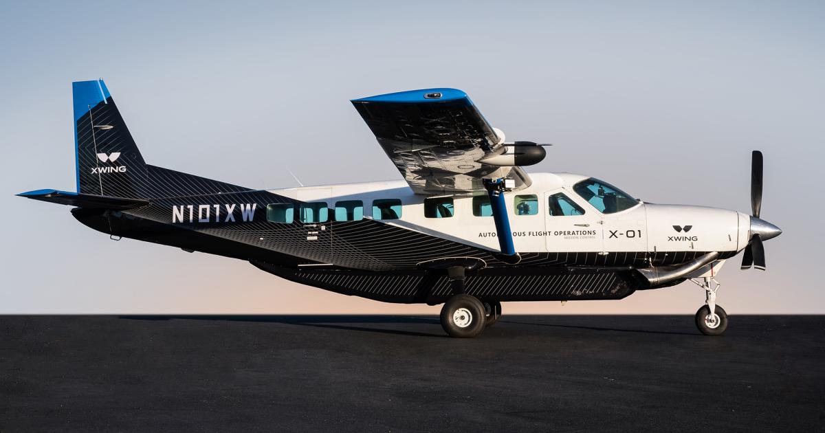 Xwing's experimental Cessna 208B Grand Caravan is pictured on9 the runway at sunset