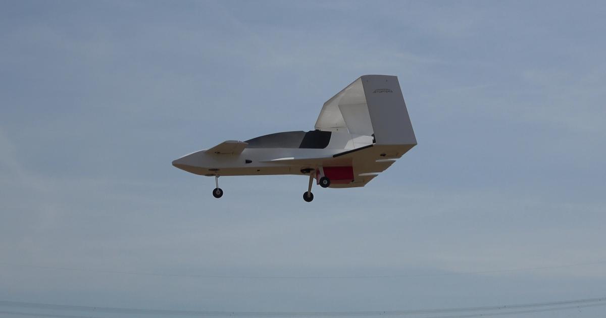A quarter-scale model of Jetoptera's J-2000 prototype eVTOL aircraft is pictured during a test flight.
