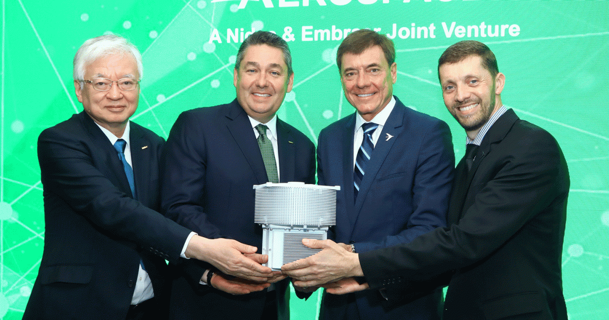 Nidec and Embraer officials show off a half-scale model of Nidec Aerospace's new electric motor during a media briefing at the Paris Airshow on June 18, 2023. Left to right: Nidec senior v-p Takamitsu Araki, Nidec president Michael Briggs, Embraer president and CEO Francisco Gomes Neto, and Embraer senior v-p of innovation and corporate strategy Dimas Douglas Tomelin.