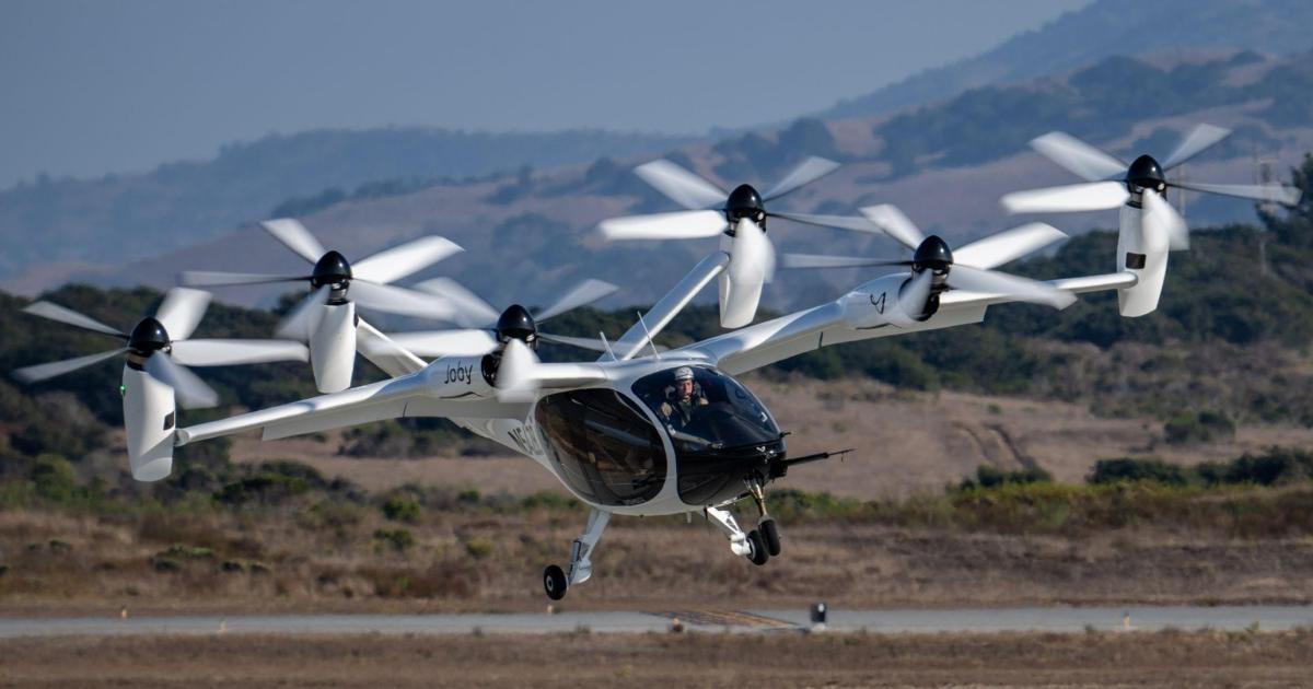 Joby experimental test pilot Zach Reeder flies the company's preproduction prototype eVTOL aircraft in Marina, California.