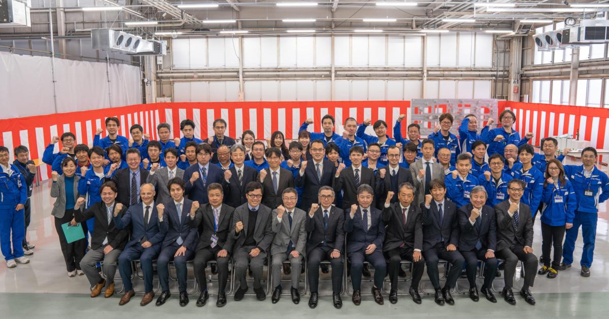 The Sky Works team poses for a photo in the factory where it is building the SD-05 eVTOL aircraft.