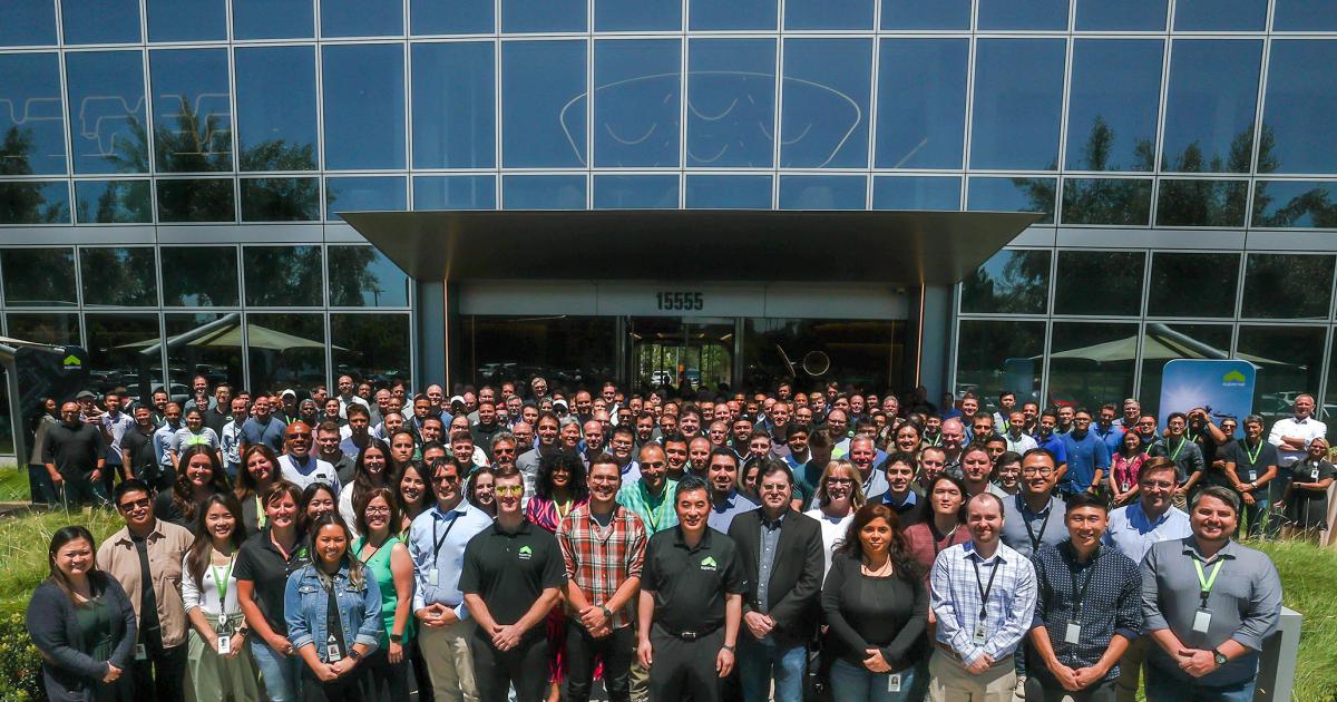 Supernal employees pose for a group photo in front of the company's new engineering headquarters in Irvine, California.