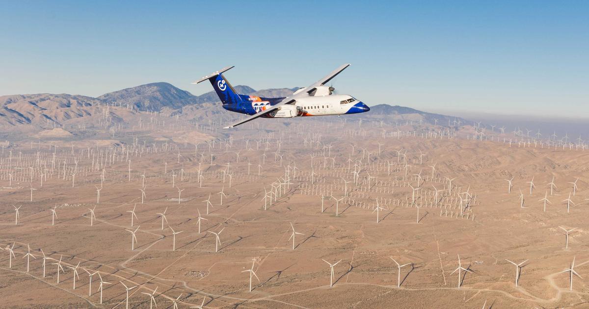 Universal Hydrogen’s Dash 8 testbed is pictured in flight over the Mojave Wind Farm