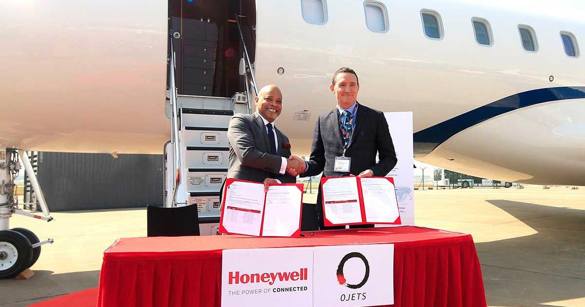 Andy Gill, Honeywell Aerospace senior director, business & general aviation, Asia Pacific region, celebrates the connectivity deal with OJets CEO, Nick Houseman, at the ABACE show in Shanghai on Tuesday, April 17.