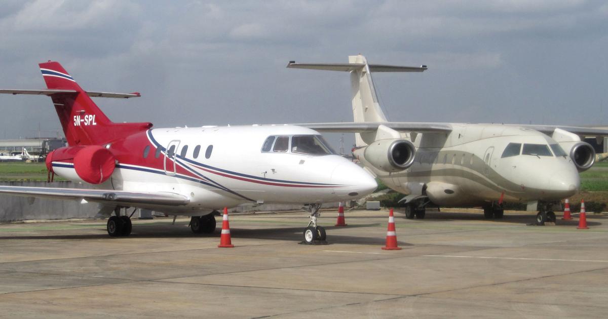 One of the most popular business jets in the African fleet in the Hawker 800, such as this Nigerian-registered Hawker on the left. There are 27 Hawker 800s based and operating in the region, out of a total fleet of 524 business jets there. (Photo: David Donal/AIN)