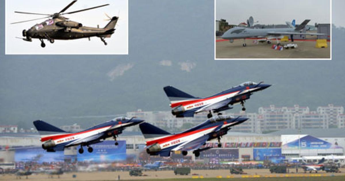 Three J-10 fighters from China’s premier jet aerobatic team take off to display during Airshow China at Zhuhai this week. The Z-10 attack helicopter made its airshow debut during the show. (Photo: Vladimir Karnozov)