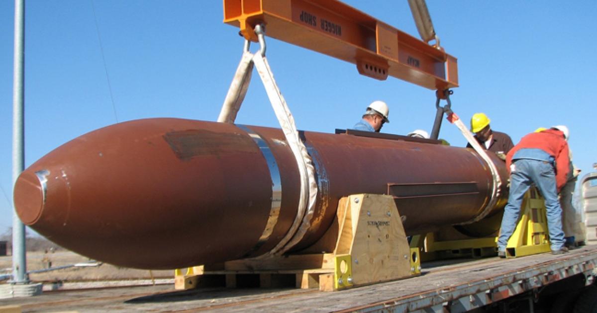 Test personnel with the Defense Threat Reduction Agency prepare to offload the Massive Ordnance Penetrator for a static test at White Sands Missile Range, N.M. (Photo: DTRA)
