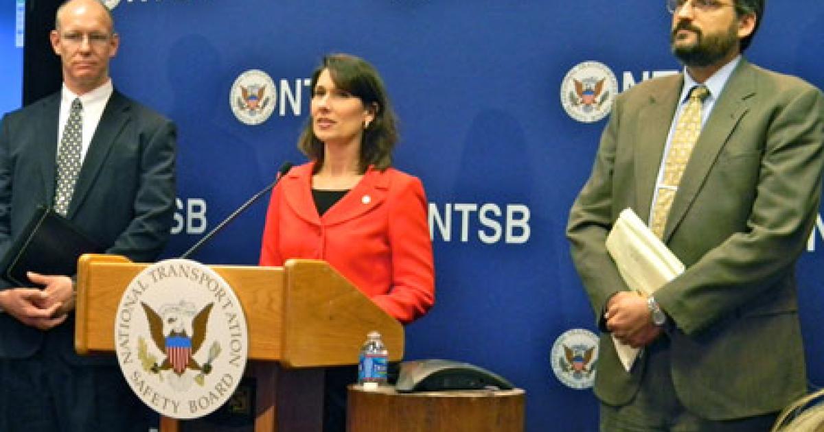 Deborah Hersman, chairman of the National Transportation Board (NTSB), briefs the press in Washington, D.C., on January 24. At left stands John DeLisi, director of the NTSB office of aviation safety, and, at right, Joseph Kolly, director of the office of research engineering. (Photo: Bill Carey)  