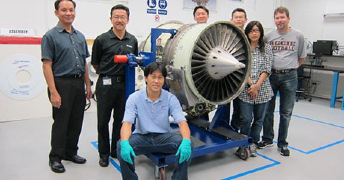Dallas Airmotive’s Singapore Regional Turbine Center (RTC) team completed its first major periodic inspection on a Honeywell TFE731. The Singapore RTC is the only such approved facility in the region. Pictured left to right: Michael Chong, quality manager; Francis Lee, general manager; Yow Kim Fui, engineer (seated); Bryan Pay, technician; Teo Boon Choy, technician; Gio Choon, administrator; and Jeff Baust, quality supervisor.