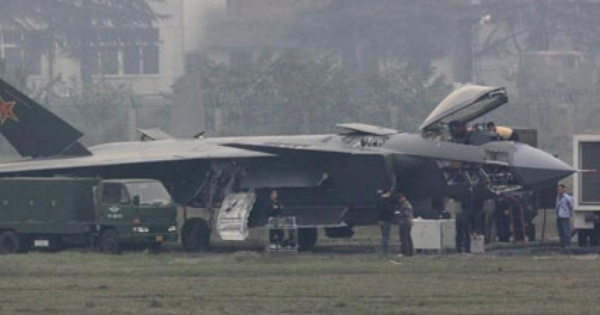 One of China’s J-20 prototypes receives attention; this one might be a ground-test article only. (Photo: Chinese Internet)