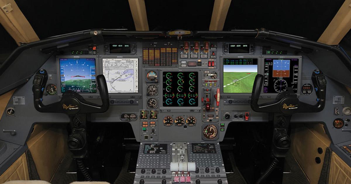  The Duncan Aviation upgrade of the Falcon 900B cockpit carries a new avionics suite from Universal Avionics.