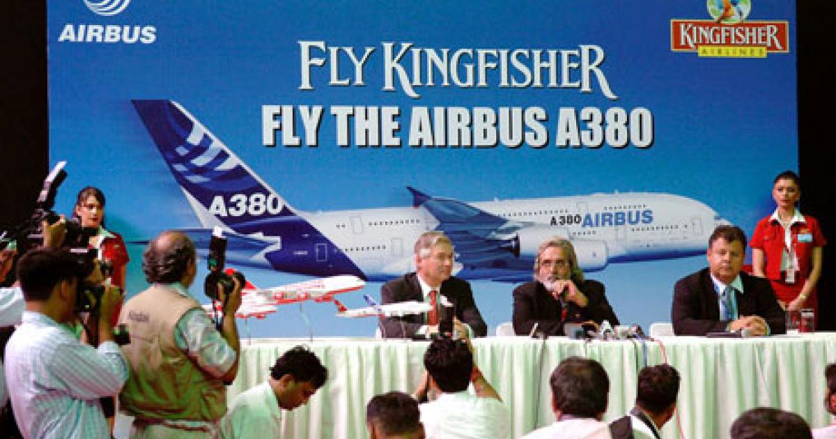 Fortunes have reversed for Kingfisher Airlines since 2007, when the carrier’s CEO, Vijay Mallya (seated center), hosted Airbus COO for customers John Leahy (left) and Airbus executive v-p Kiran Rao during a New Delhi press conference promoting Kingfisher’s since dashed plans to fly the A380. (Photo: Airbus) 