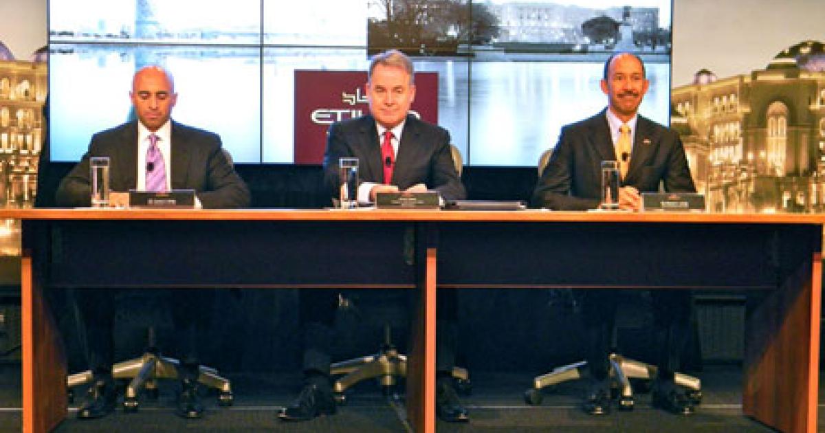 From left to right, UAE ambassador Yousef Al Otaiba, Etihad Airways CEO James Hogan and U.S. ambassador Michael Corbin commemorate the start of Etihad’s daily flights to metropolitan Washington, D.C., on April 2. (Photo: Bill Carey) 