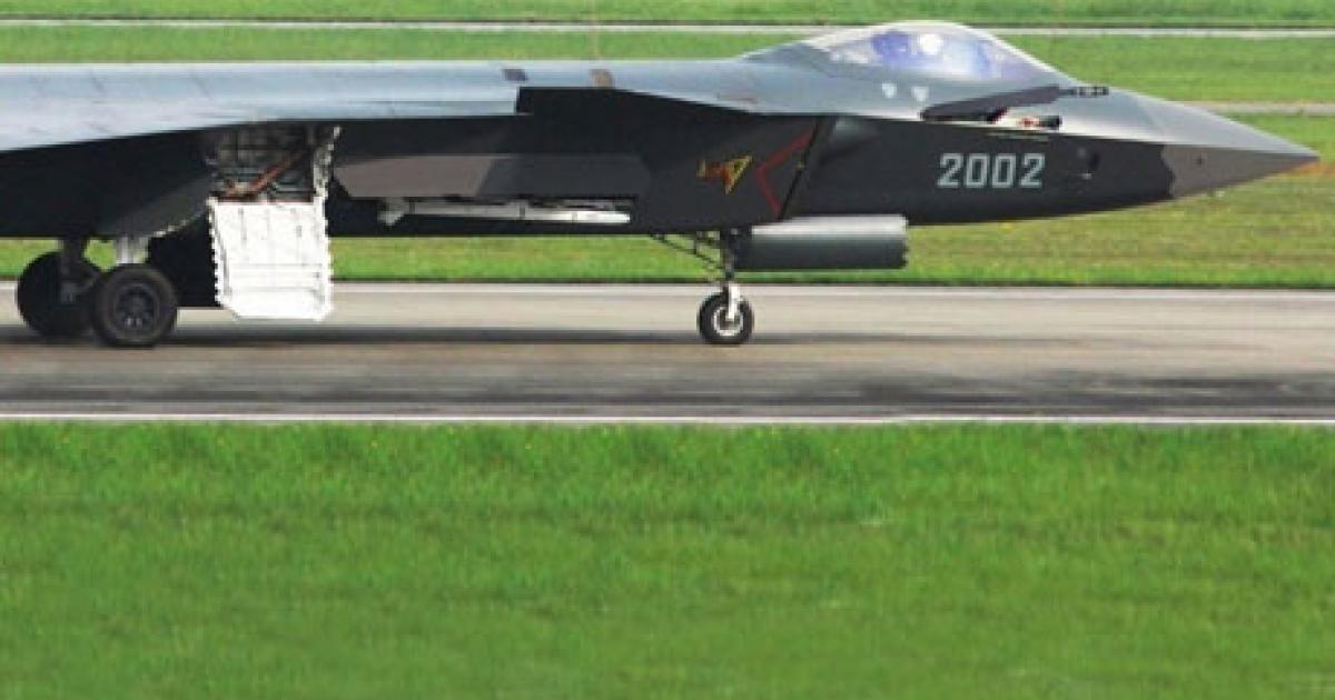 The second prototype of China’s J-20 combat aircraft taxiing with its starboard weapons-bay door open and a PL-10 air-to-air missile protruding. (Photo: Chinese Internet)