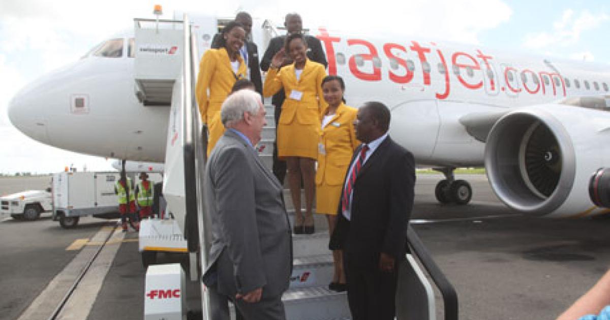 Fastjet CEO Ed Winter (foreground, left) and Charles Tizeba, Tanzania’s deputy minister for transport, celebrate the November 27 launch of Fastjet in front of the airline’s first Airbus A319 in Dar es Salaam.  (Photo: Fastjet)