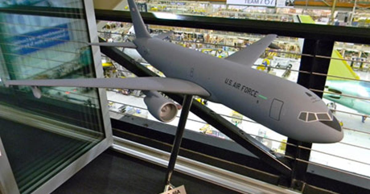 A model of the KC-46A stands above Boeing’s commercial 767 final assembly line in Everett, Washington, where the tanker will be built initially. (Photo: Bill Carey)